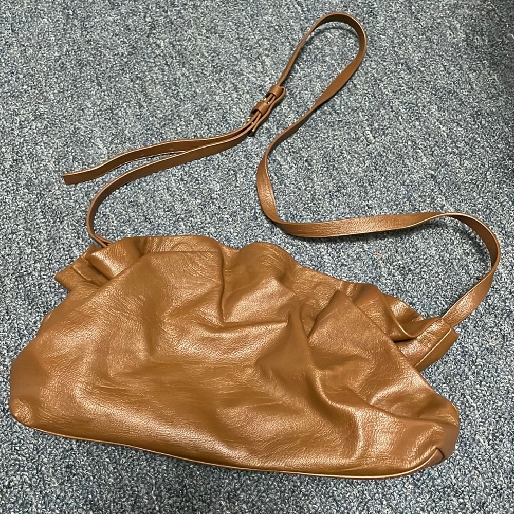 Anthropologie- Perfect brown clutch that you can also wear as a crossbody.